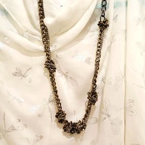 Gold and silver knotted necklace
